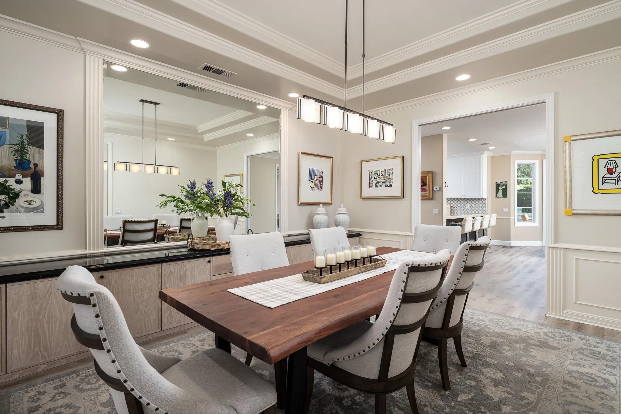 17323 Circa Del Sur Rancho Santa Fe, CA 92067 - Photo 8 of 41 a dining room with wooden floor a chandelier a wooden table and chairs