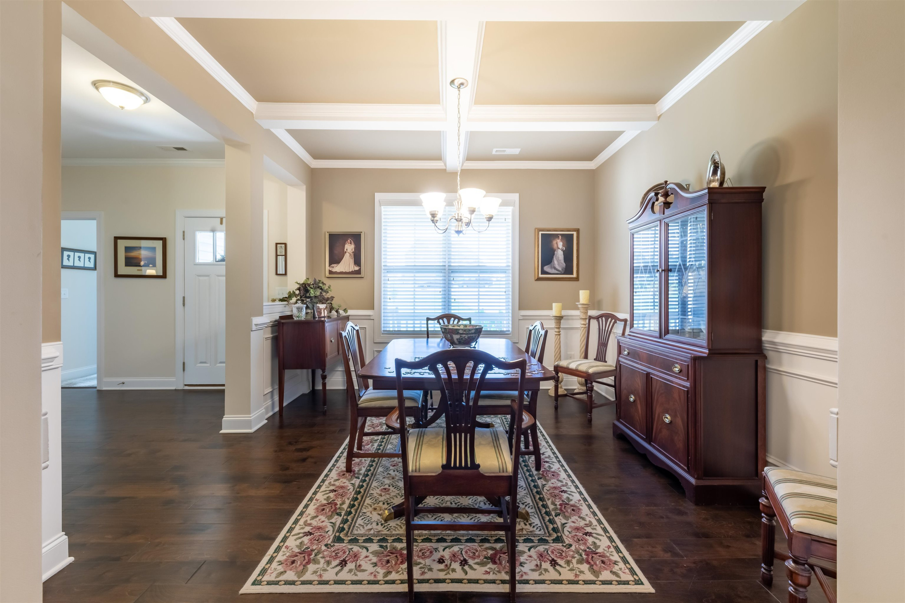 3537 Lavender Lane Wake Forest, NC 27587 - Photo 13 of 60 a dining room with wooden floor a chandelier a wooden table and chairs