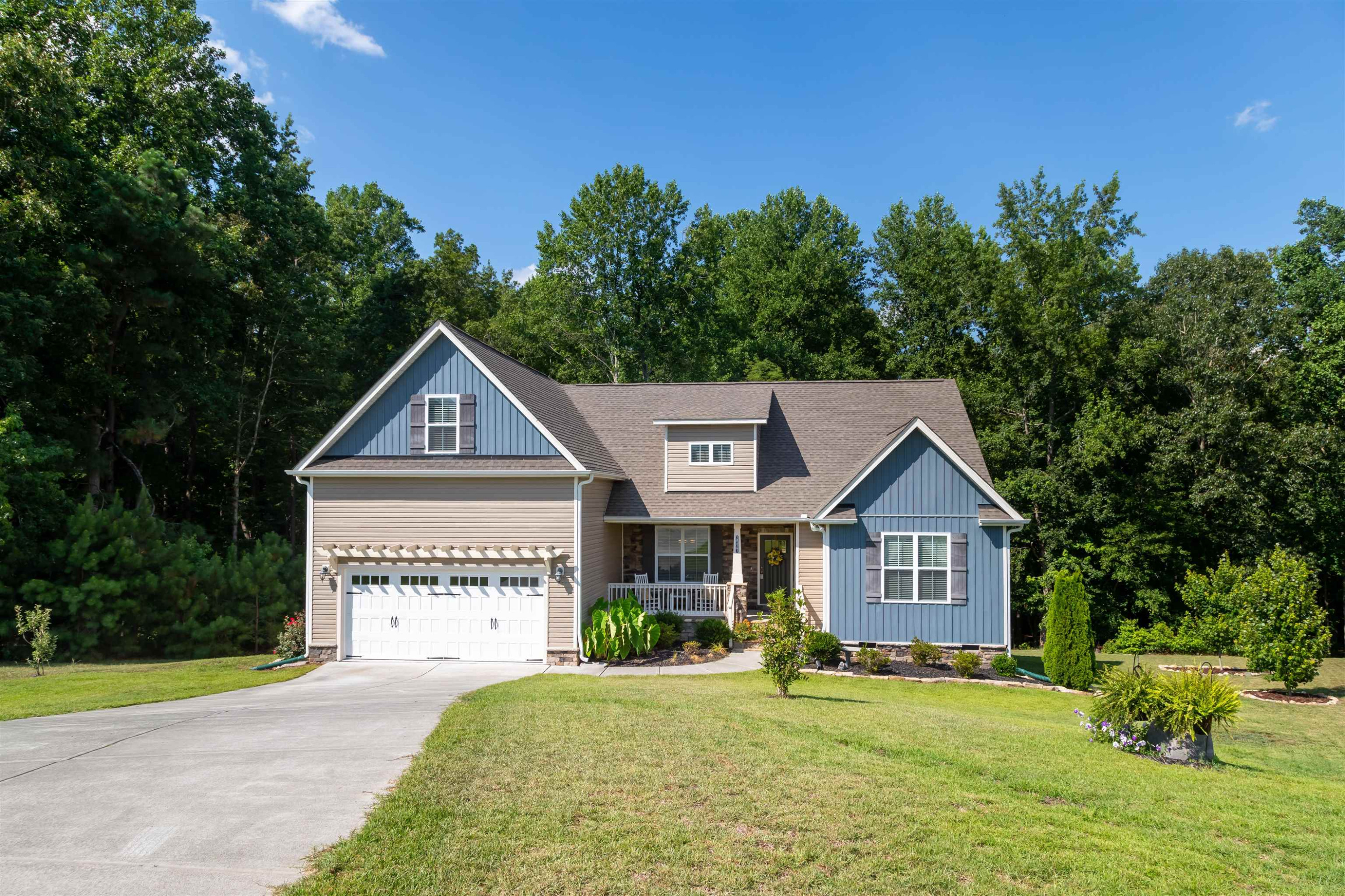 3537 Lavender Lane Wake Forest, NC 27587 - Photo 2 of 60 a front view of a house with a yard and garage