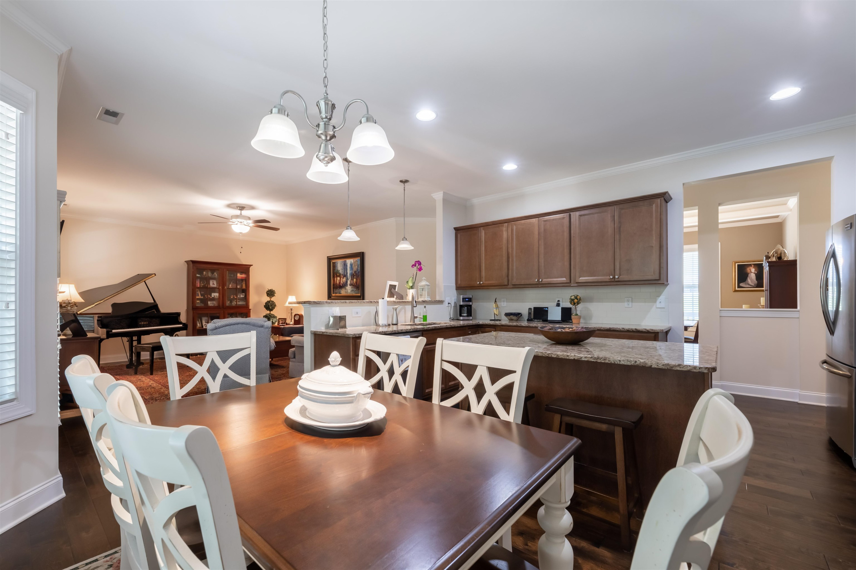 3537 Lavender Lane Wake Forest, NC 27587 - Photo 23 of 60 a view of a dining room and livingroom with furniture wooden floor and a chandelier