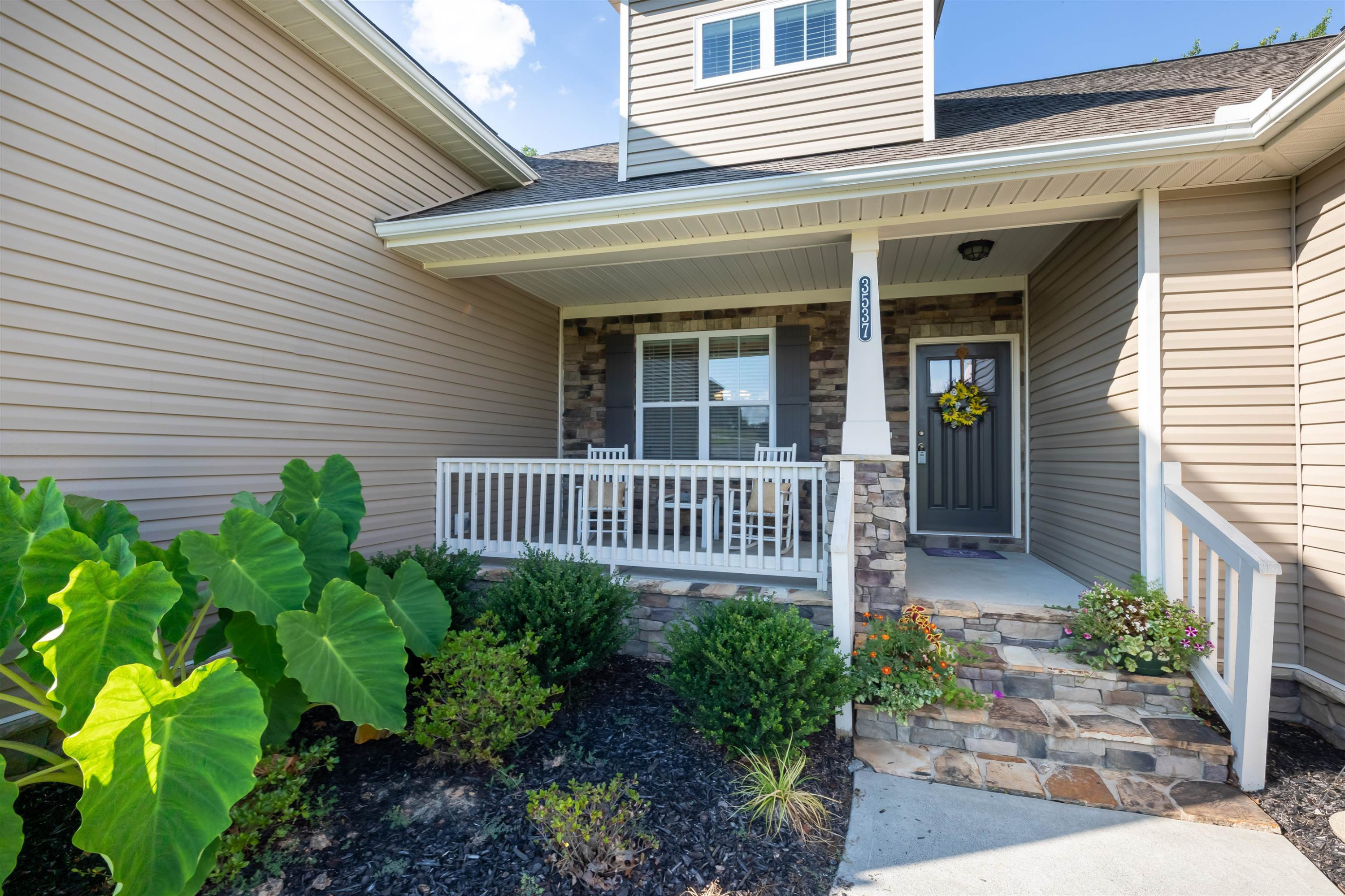 3537 Lavender Lane Wake Forest, NC 27587 - Photo 6 of 60 a view of a house with a small deck and a garden