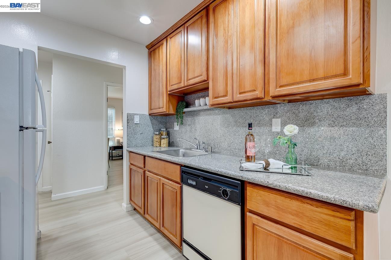 9005 Alcosta Boulevard, Unit 199 San Ramon, CA 94583 - Photo 29 of 57 a kitchen with stainless steel appliances granite countertop a sink stove and cabinets