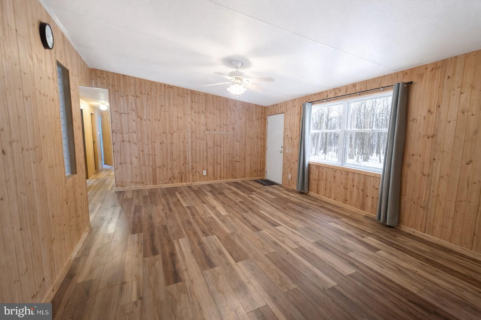 333 White Face Circle Zion Grove, PA 17985 - Photo 5 of 8 an empty room with wooden floor and windows
