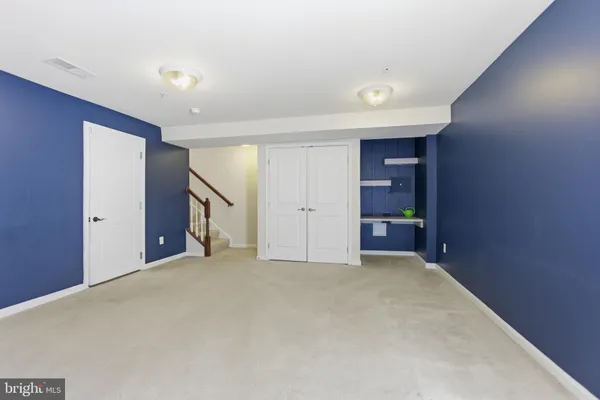 a big room with closet and a bathroom