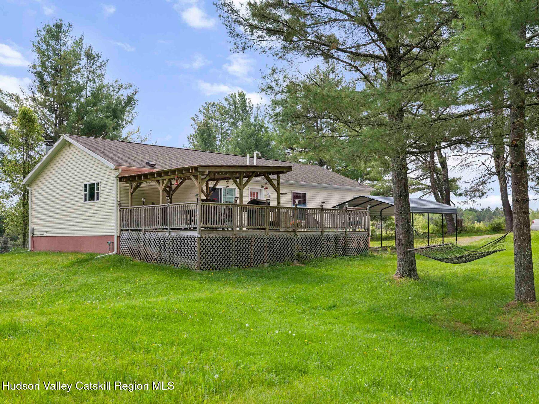 137 Mountain Pond View Road Gilboa, NY 12076 - Photo 3 of 38 a view of a house with a yard and sitting area