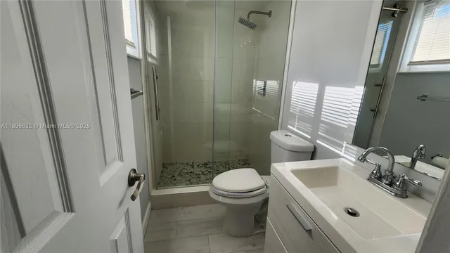 a bathroom with a sink and toilet