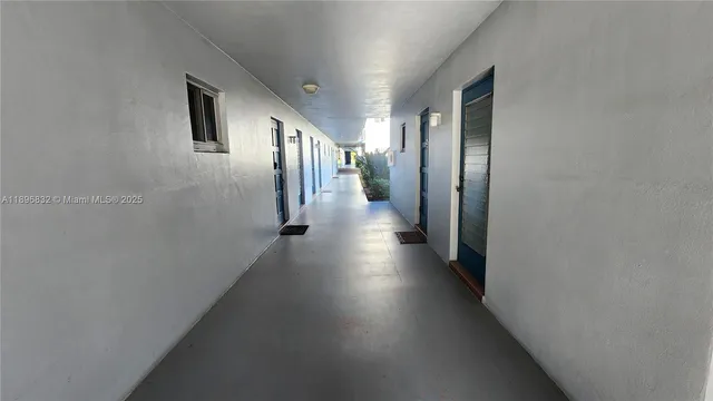 a swimming pool with outdoor seating and yard