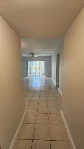a kitchen with granite countertop a sink a stove and cabinets
