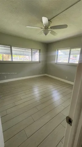 en empty room with windows