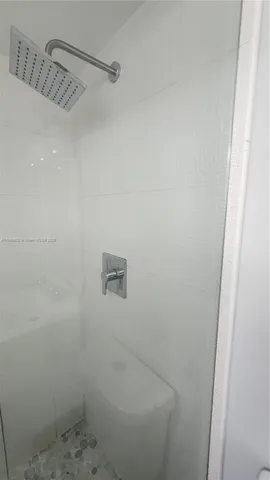 a bathroom with a toilet a sink and bathtub