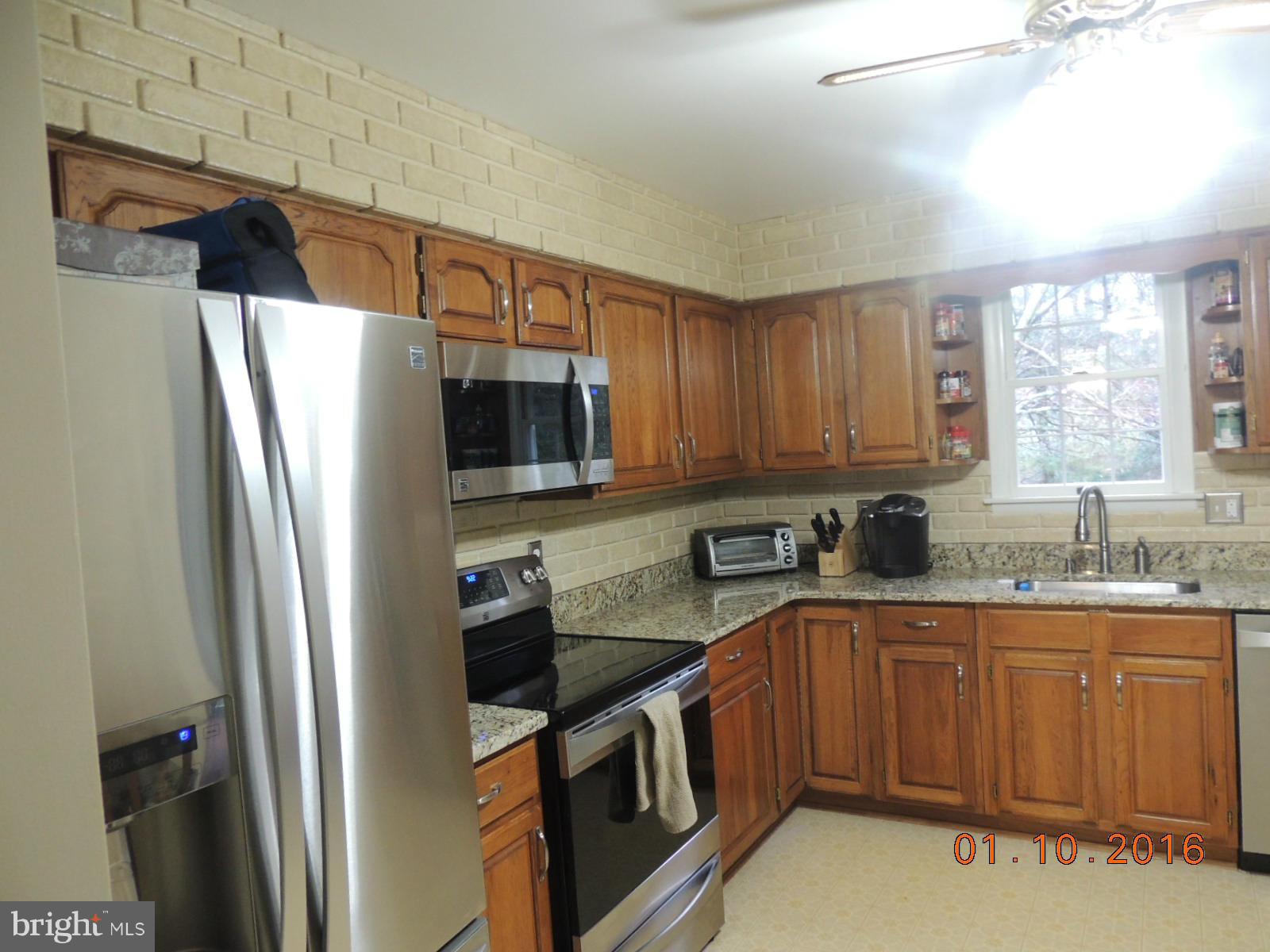 1130 Sturbridge Road Fallston, MD 21047 - Photo 11 of 29 a kitchen with stainless steel appliances granite countertop a refrigerator sink and microwave
