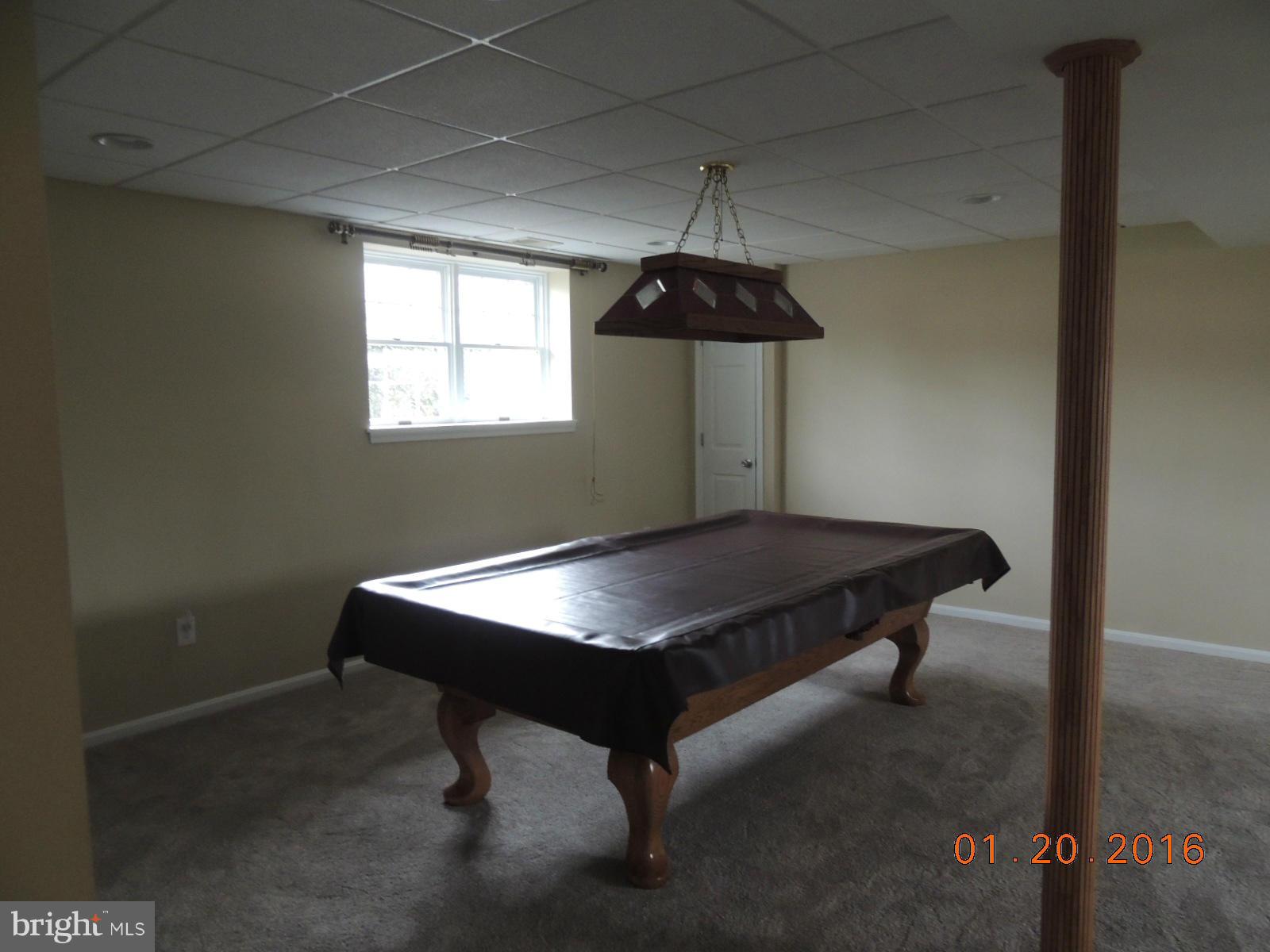 1130 Sturbridge Road Fallston, MD 21047 - Photo 22 of 29 a room with a table and a chandelier
