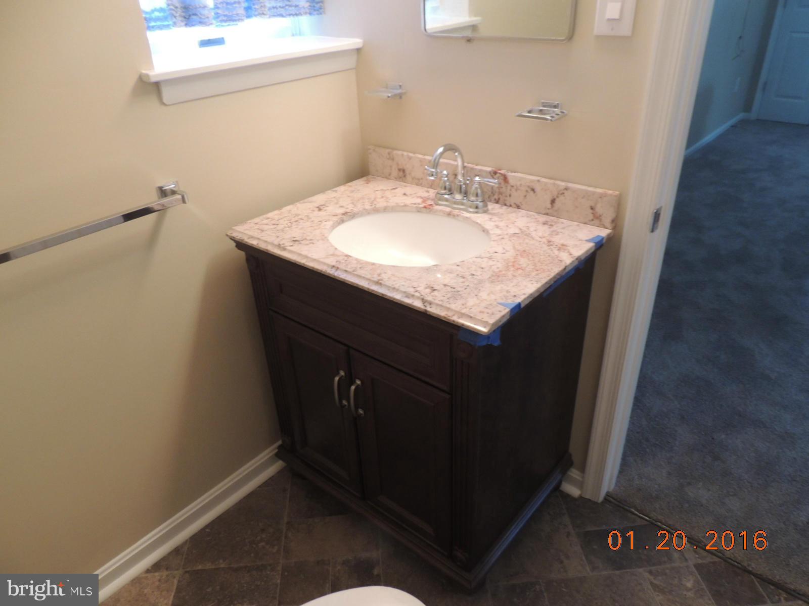 1130 Sturbridge Road Fallston, MD 21047 - Photo 26 of 29 a bathroom with a sink and a mirror