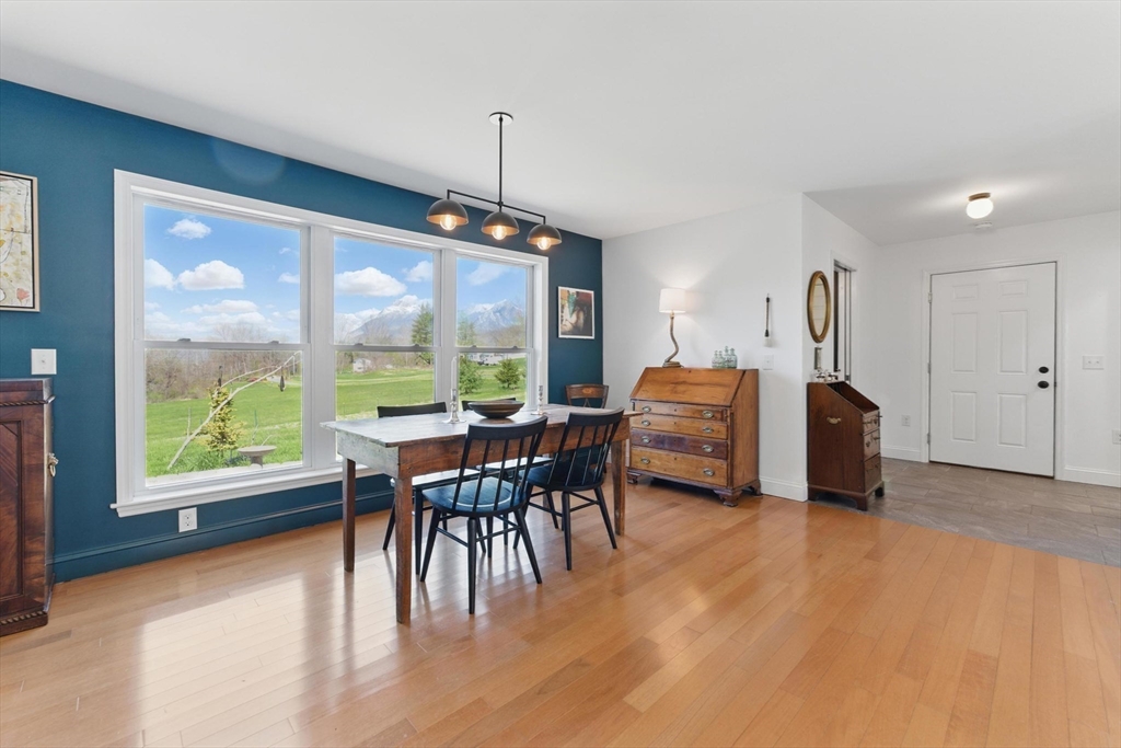 96 Cold Hill Granby, MA 01033 - Photo 14 of 42 a dining room with furniture and a floor to ceiling window