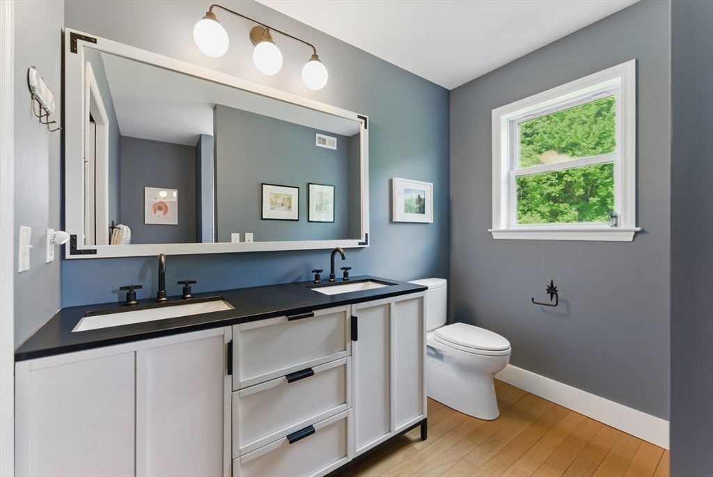 96 Cold Hill Granby, MA 01033 - Photo 20 of 42 a bathroom with a granite countertop sink vanity mirror and toilet