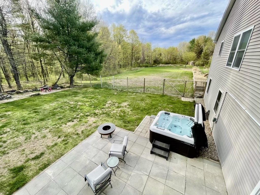 96 Cold Hill Granby, MA 01033 - Photo 29 of 42 a view of backyard with seating area and green space