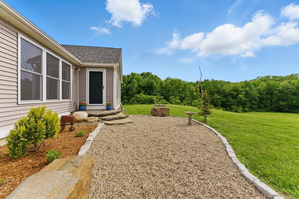 96 Cold Hill Granby, MA 01033 - Photo 3 of 42 a view of a house with backyard and sitting area