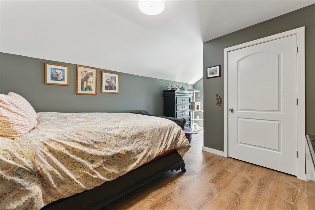 96 Cold Hill Granby, MA 01033 - Photo 36 of 42 a bed sitting in a bedroom next to a bedroom