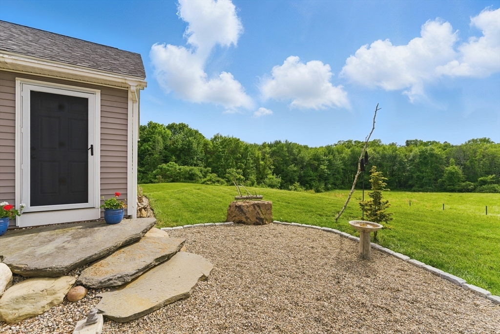 96 Cold Hill Granby, MA 01033 - Photo 4 of 42 a view of a garden with large trees