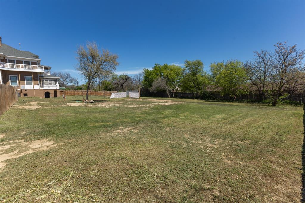 1115 Austin Street Coleman, TX 76834 - Photo 38 of 40 a view of a field with an trees in front of it