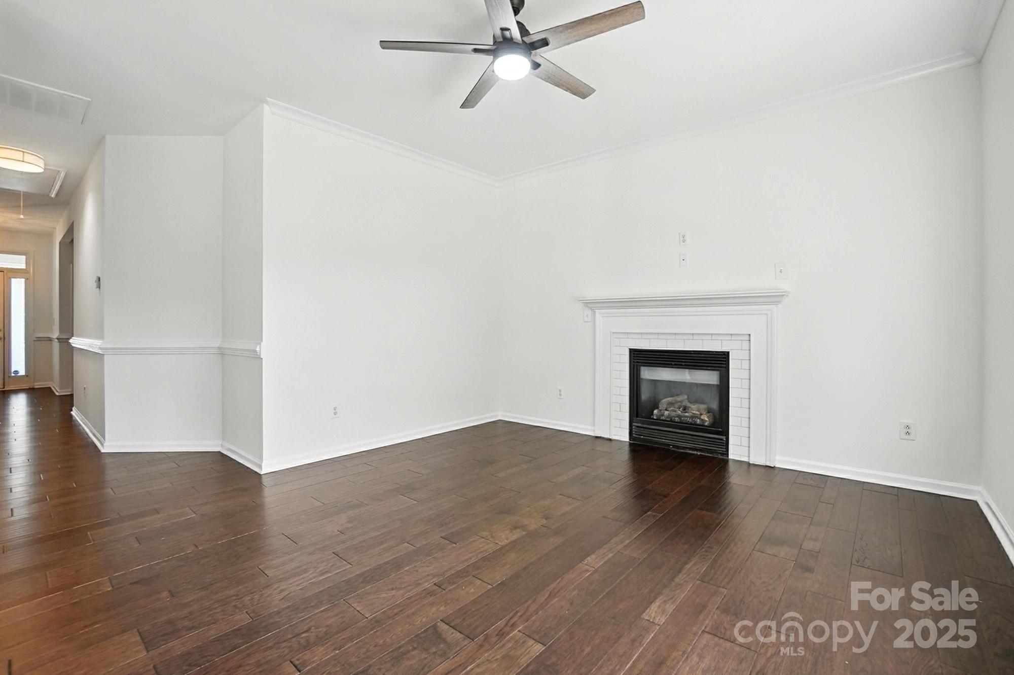 8710 Arrowhead Pl Lane Cornelius, NC 28031 - Photo 36 of 48 a view of an empty room with wooden floor and a window