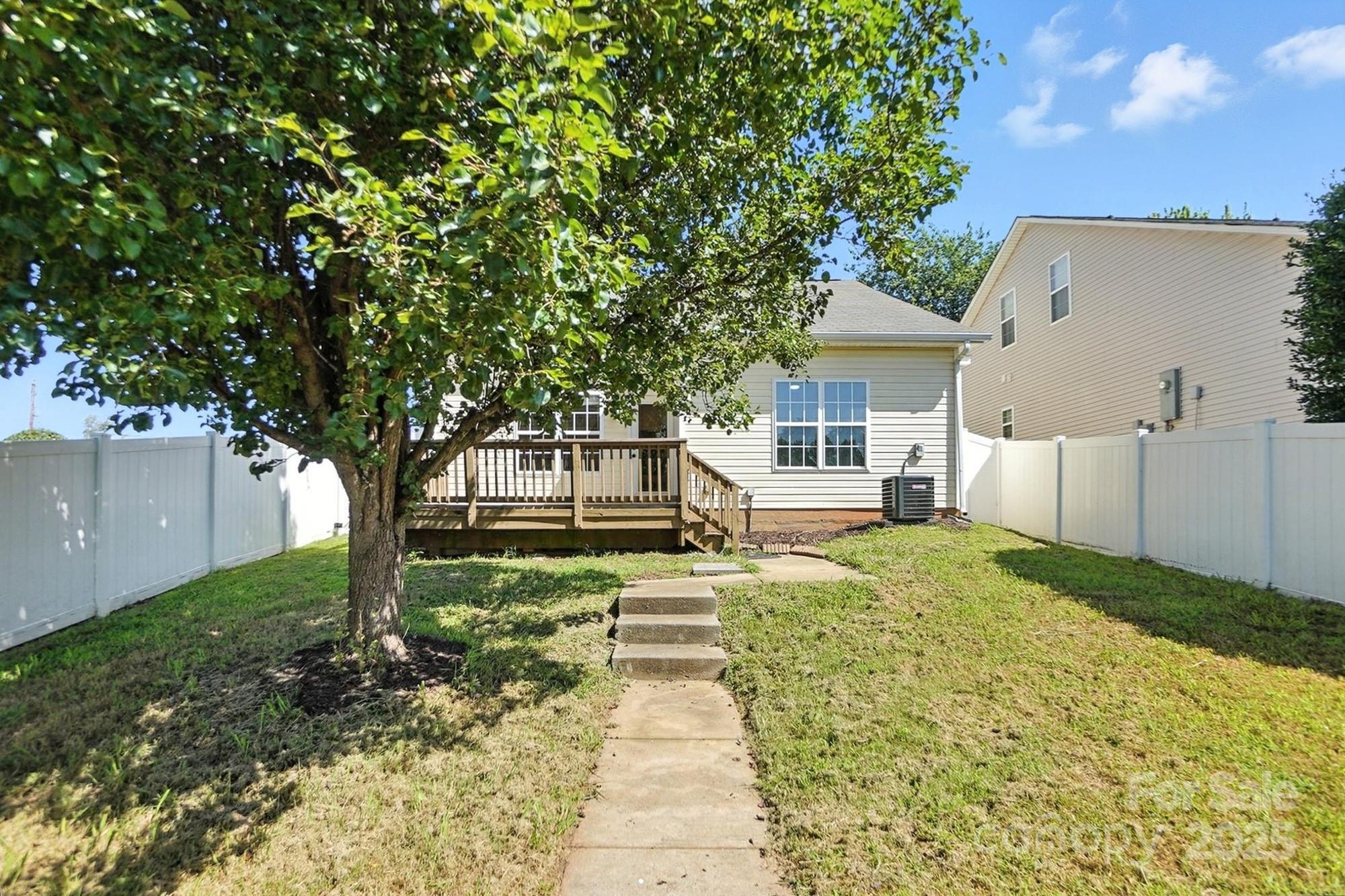 8710 Arrowhead Pl Lane Cornelius, NC 28031 - Photo 41 of 48 a front view of a house with garden
