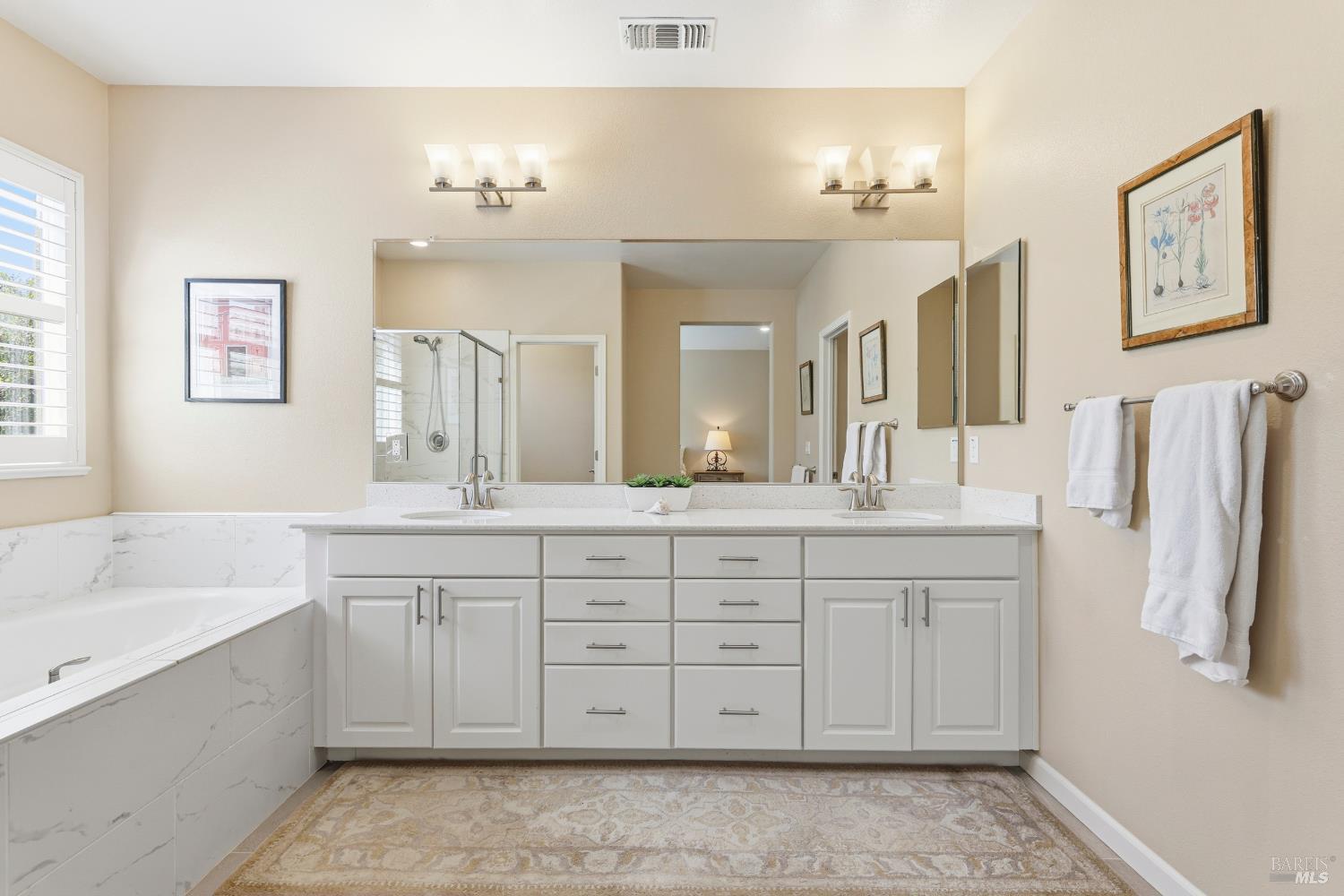 5533 Kennedy Place Rohnert Park, CA 94928 - Photo 24 of 63 a spacious bathroom with a double vanity sink mirror and double