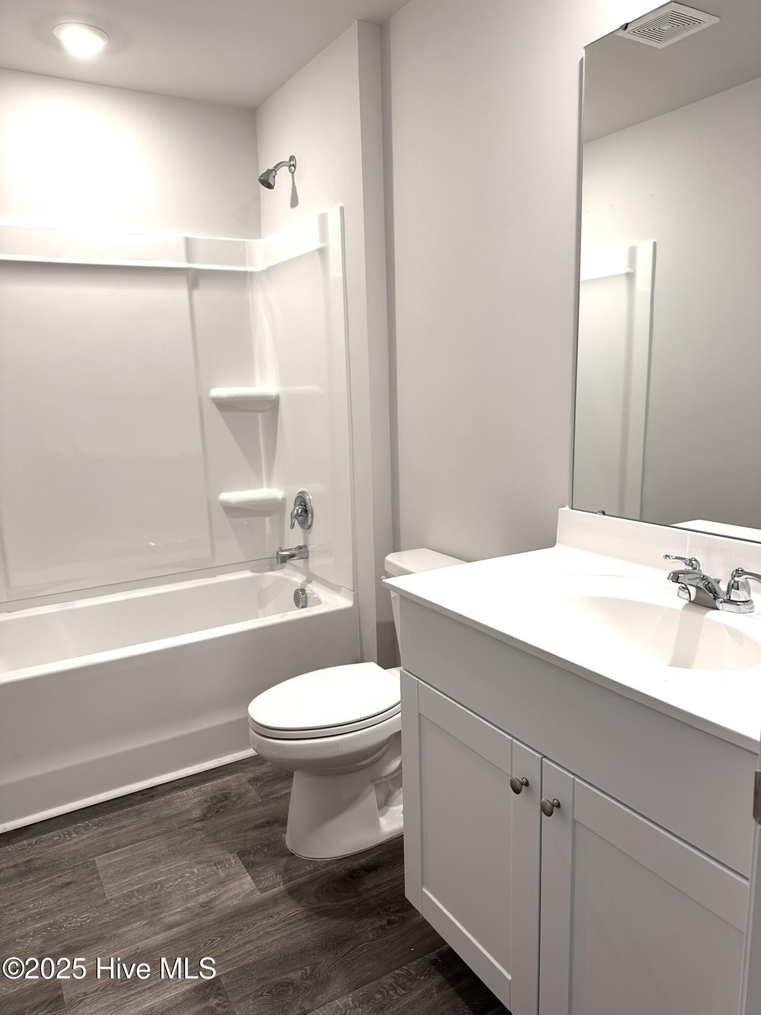 1139 Spadefish Drive Northwest, Unit LOT 146 WOODHAVEN Sunset Beach, NC 28468 - Photo 9 of 12 Hall bathroom with one sink and long counter.