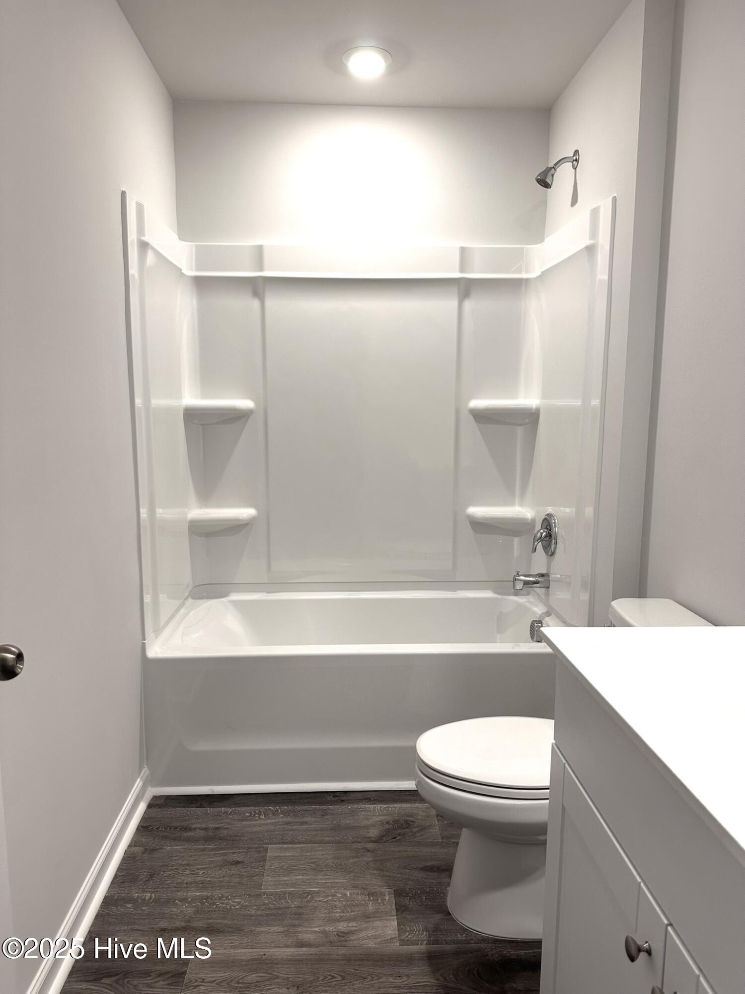 1139 Spadefish Drive Northwest, Unit LOT 146 WOODHAVEN Sunset Beach, NC 28468 - Photo 10 of 12 Hall bathroom has a full bath tub.