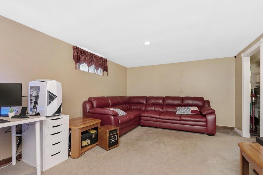 847 North Road Carlisle, MA 01741 - Photo 15 of 20 a couch sitting in a room next to a window