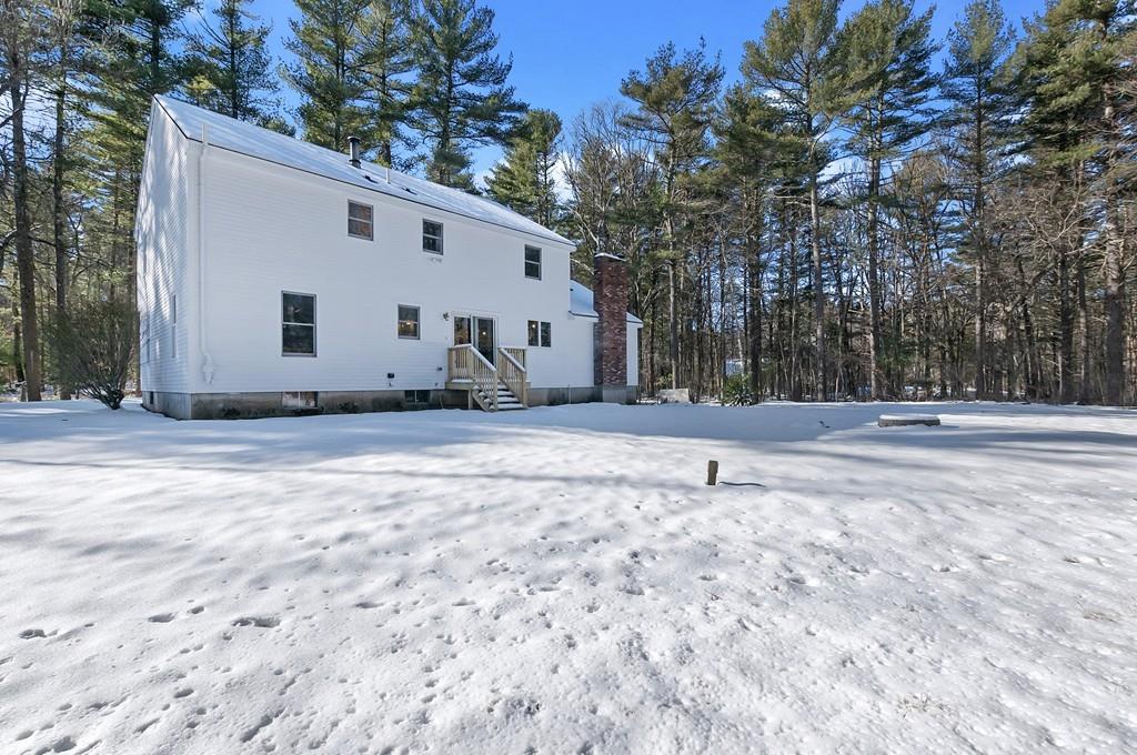 847 North Road Carlisle, MA 01741 - Photo 20 of 20 a house with trees in front of it