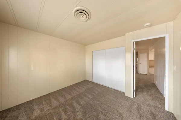 an empty room with a bathroom