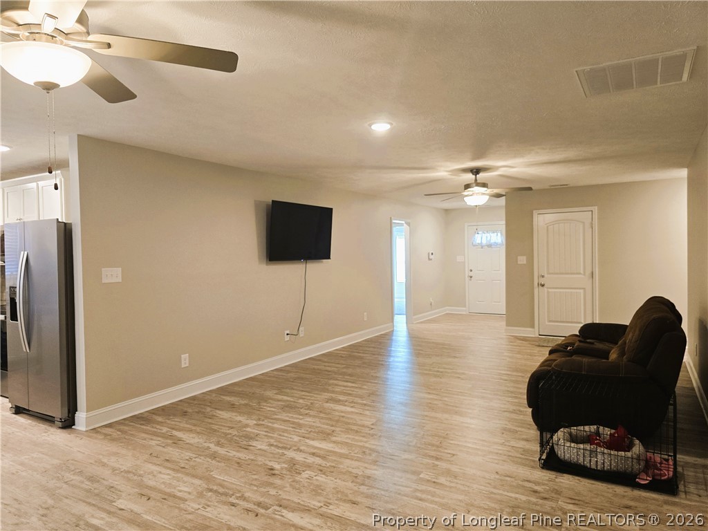 422 Mitchell Farm Road Goldsboro, NC 27530 - Photo 17 of 28 a living room with furniture and a flat screen tv