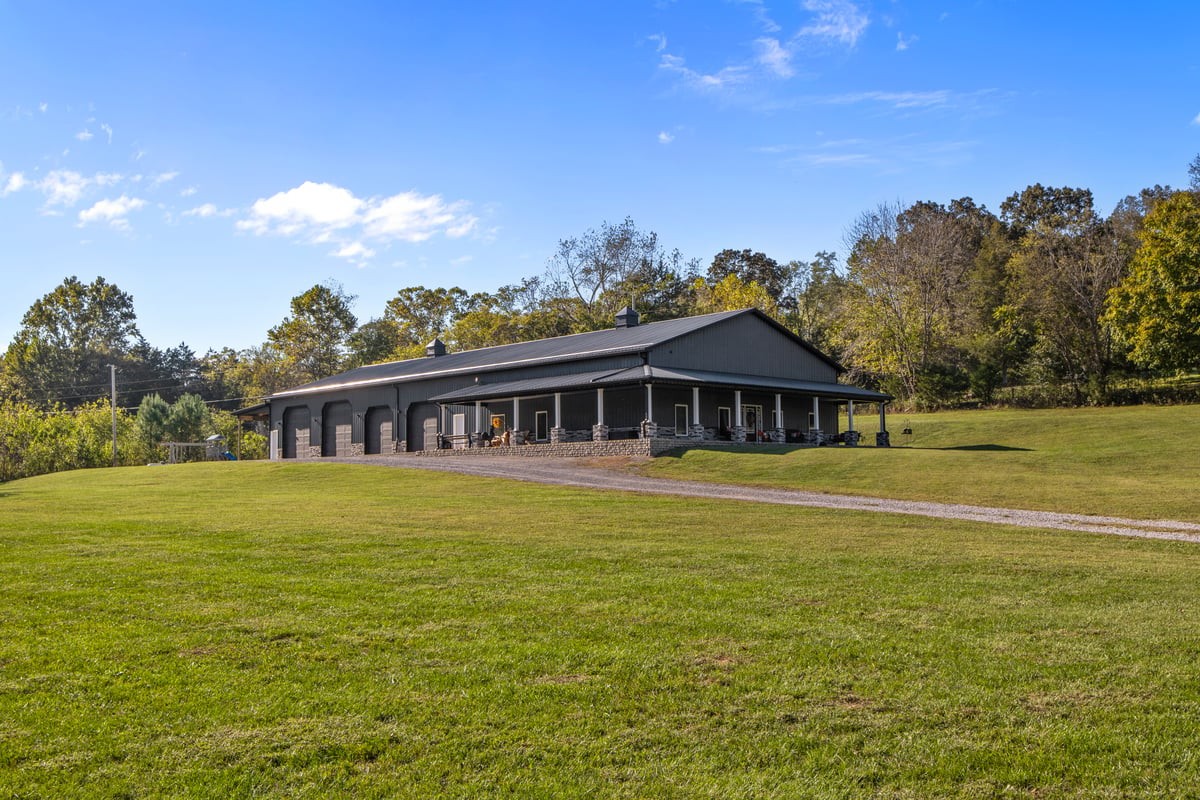 a front view of a house with a big yard