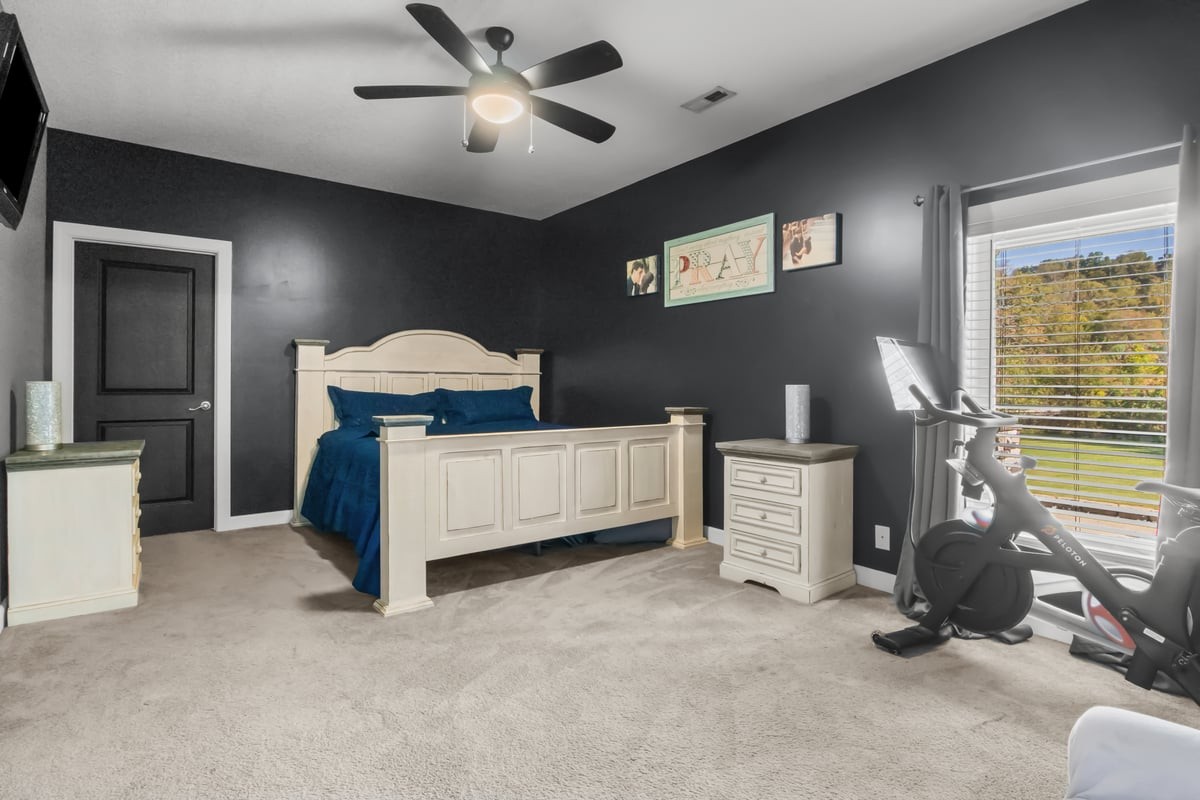 3950 Budds Creek Road Palmyra, TN 37142 - Photo 19 of 54 a bedroom with furniture and a window