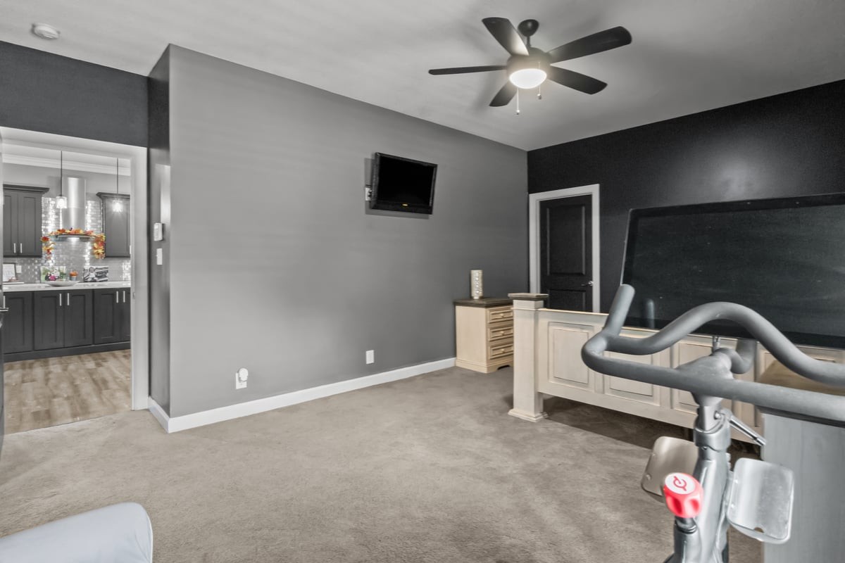 3950 Budds Creek Road Palmyra, TN 37142 - Photo 20 of 54 a room with gym equipment and a flat screen tv
