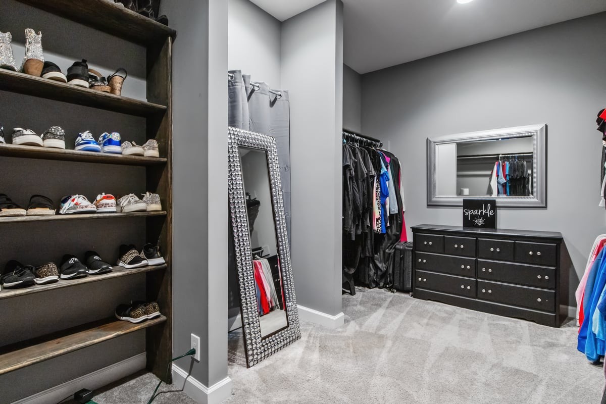 3950 Budds Creek Road Palmyra, TN 37142 - Photo 22 of 54 a view of walk in closet with clothes and shoes
