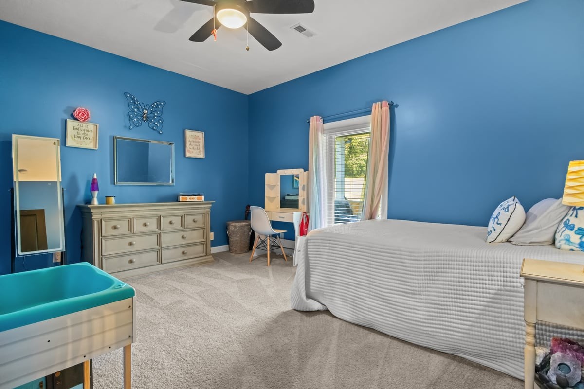 3950 Budds Creek Road Palmyra, TN 37142 - Photo 27 of 54 a bedroom with a bed and a table