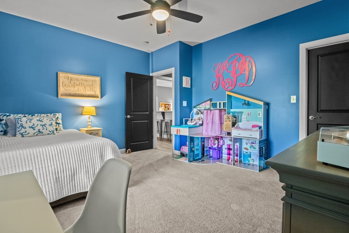 3950 Budds Creek Road Palmyra, TN 37142 - Photo 28 of 54 a bedroom with a bed and a flat screen tv