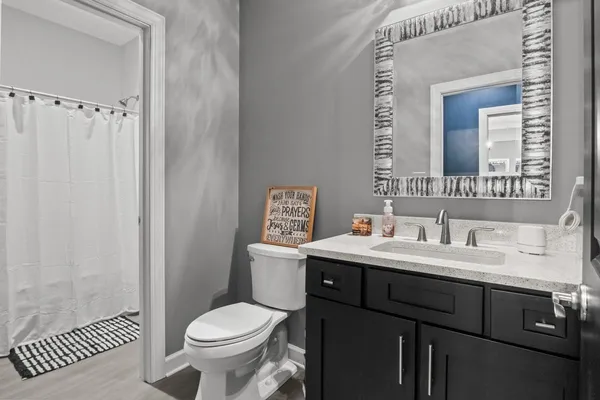 a bedroom with furniture and a chandelier