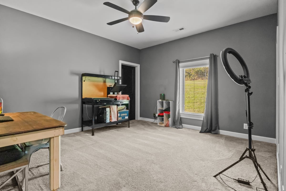 3950 Budds Creek Road Palmyra, TN 37142 - Photo 32 of 54 a room with furniture and a flat screen tv