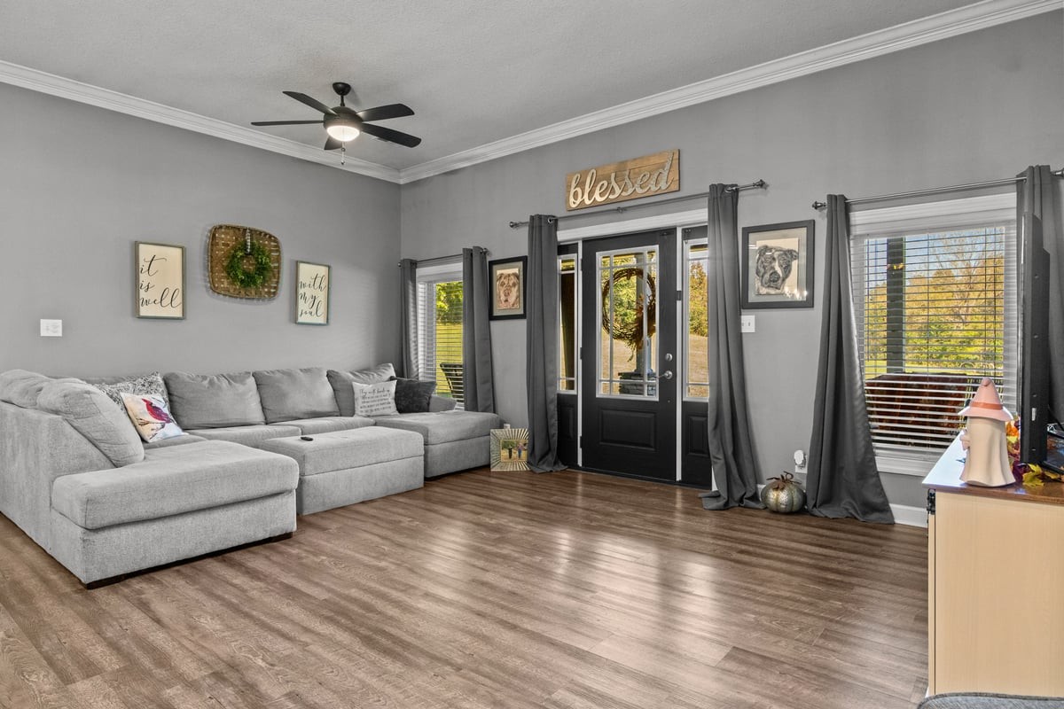 3950 Budds Creek Road Palmyra, TN 37142 - Photo 4 of 54 a living room with furniture and wooden floor