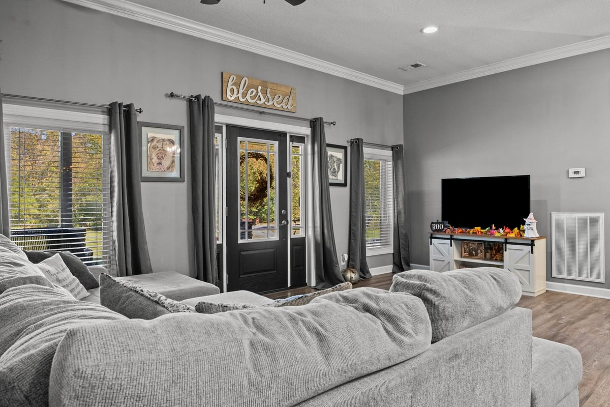 3950 Budds Creek Road Palmyra, TN 37142 - Photo 5 of 54 a bedroom with a bed and a flat screen tv