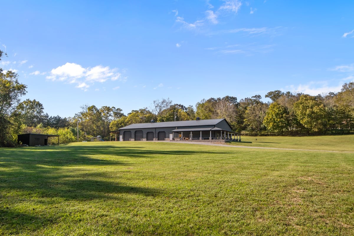 3950 Budds Creek Road Palmyra, TN 37142 - Photo 53 of 54 a view of a big room with a big yard and large trees