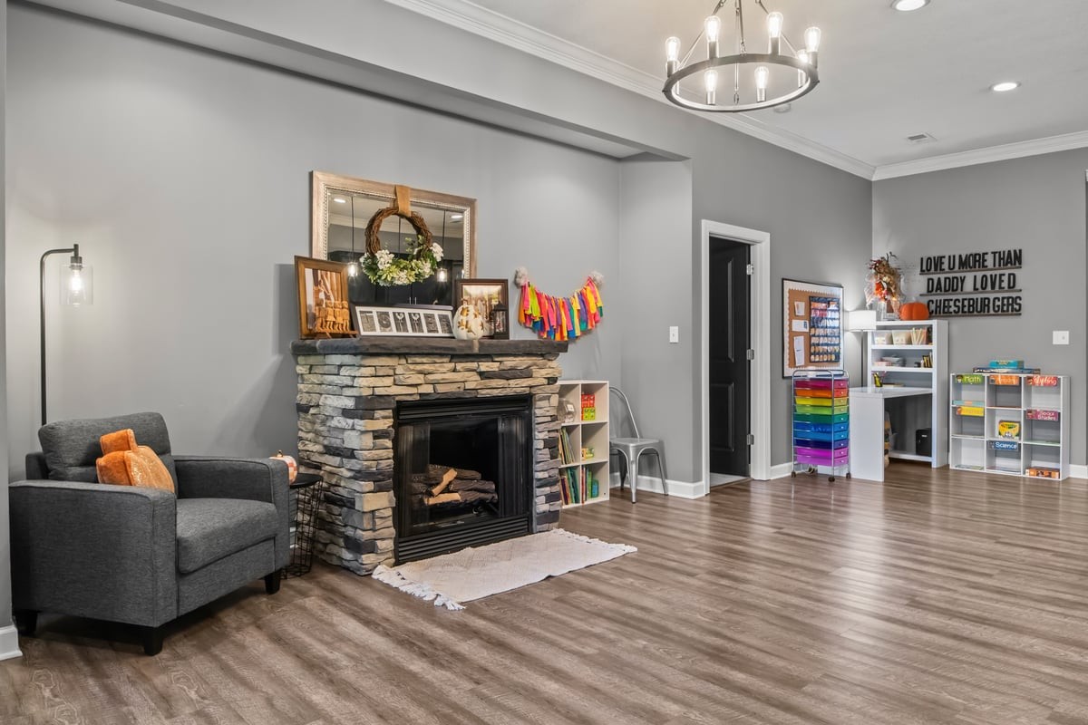 3950 Budds Creek Road Palmyra, TN 37142 - Photo 6 of 54 a living room with furniture and a fireplace