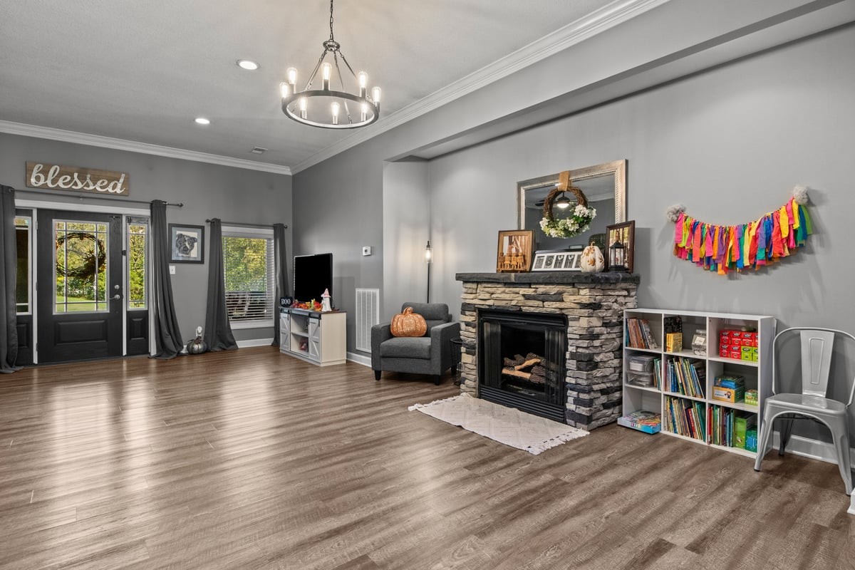 3950 Budds Creek Road Palmyra, TN 37142 - Photo 7 of 54 a living room with fireplace furniture and a flat screen tv