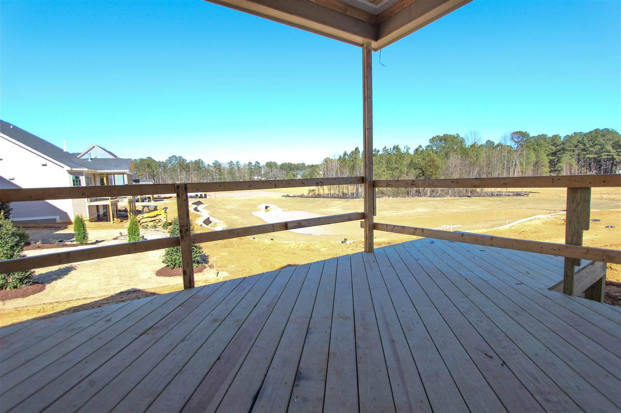 7748 Wilderness Road Raleigh, NC 27613 - Photo 22 of 25 Beautiful view of the pond, see rendering for future pond representation Screen Porch