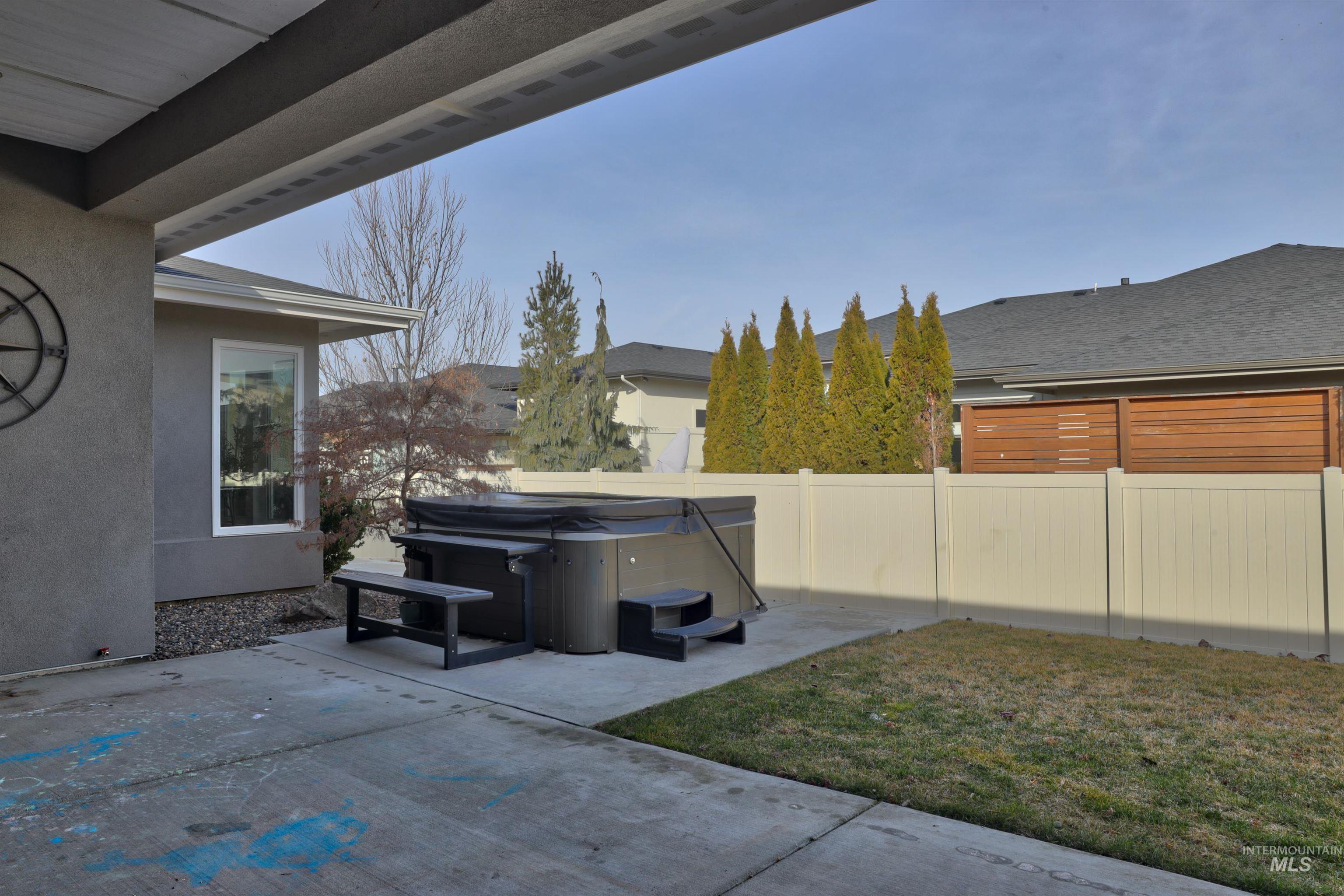 4148 East Copper Point Drive Meridian, ID 83642 - Photo 21 of 26 View of patio with a hot tub