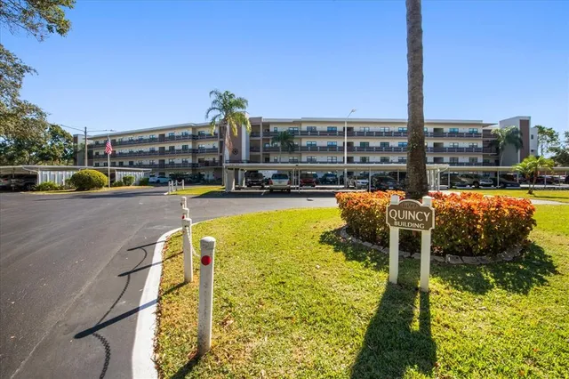 aerial view of a house with balcony and swimming pool