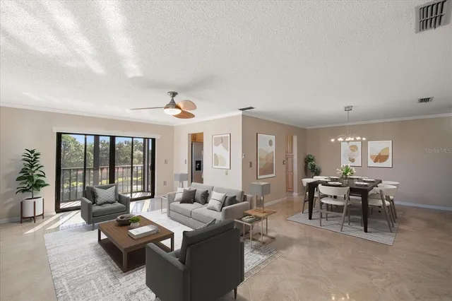 a living room with furniture and large windows